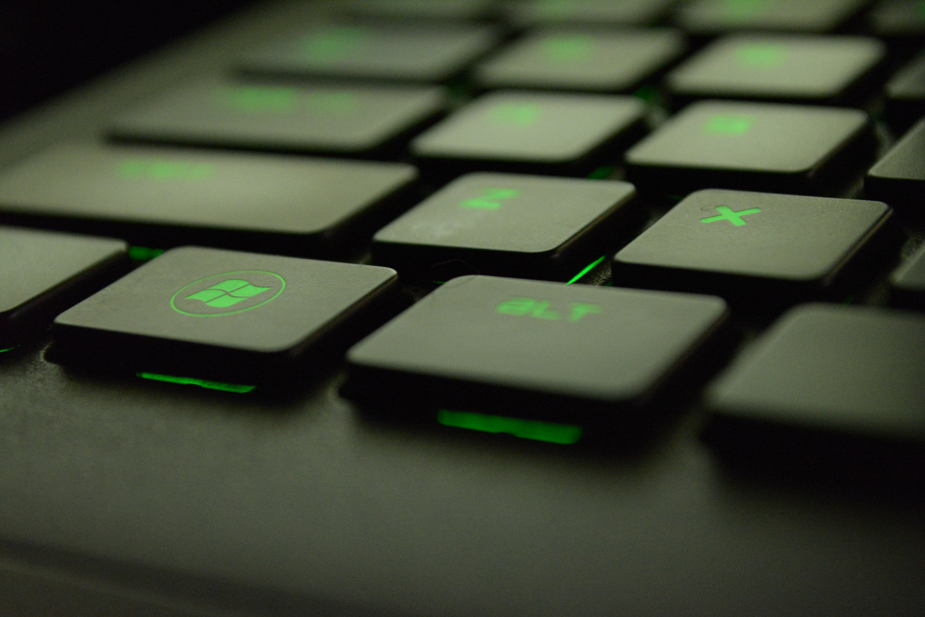 Close-up Photography of Black and Green Computer Keyboard Keys